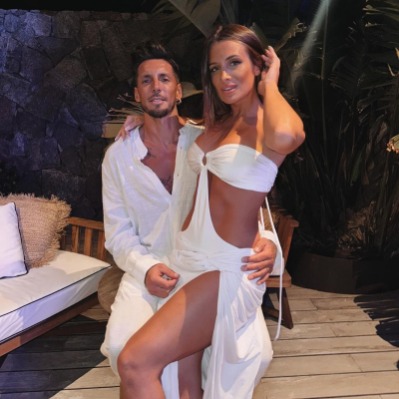 Camila Homs sitting on the lap of her new boyfriend, José Sosa.